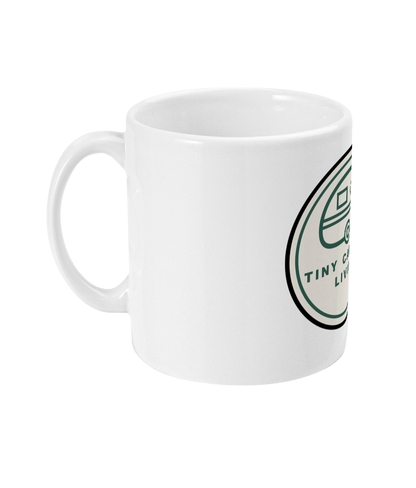 White Tiny Caravan Living Signature Badge ceramic mug with handle on the left