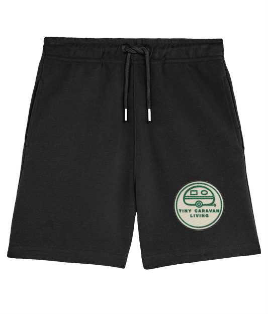 Tiny Caravan Living Signature Kids’ Shorts in Black with embroidered badge on the front left leg