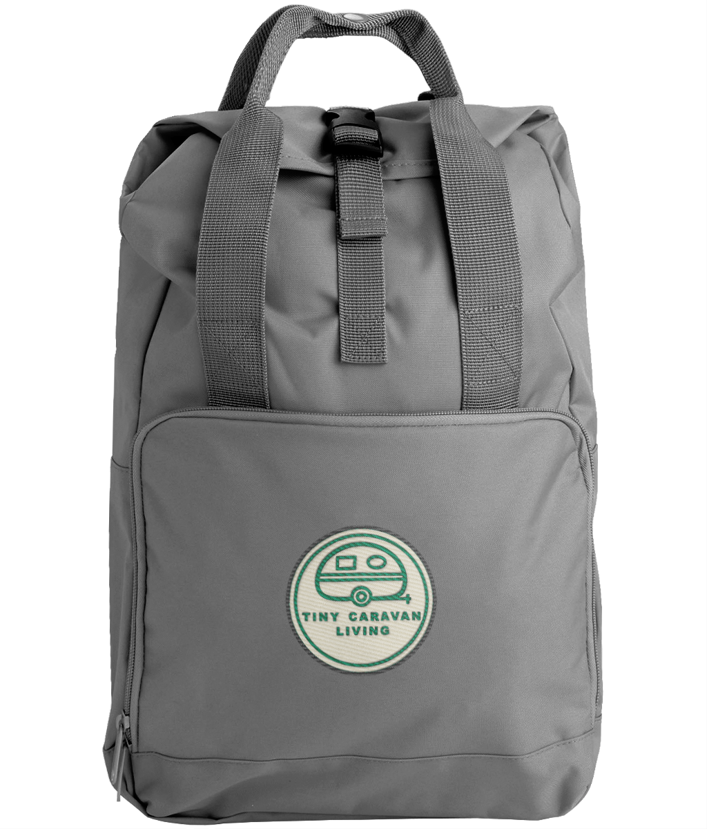 Tiny Caravan Living Signature Roll-Top Backpack in Graphite Grey with embroidered signature badge